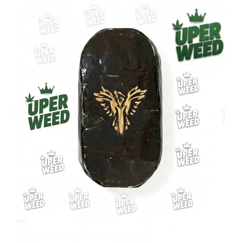Phoenix Hash cannabis concentrate in premium packaging, displayed against a deep green background with clean modern styling. 2